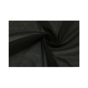 Close-up of black sheer mesh fabric with sparkling rhinestones and delicate texture