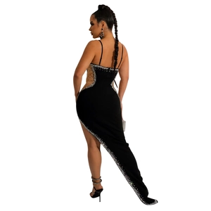 Detail of elegant black slim-fit evening gown featuring sparkling rhinestones and long train