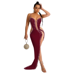 Detail of burgundy evening gown with rhinestone accents and sheer mesh patchwork