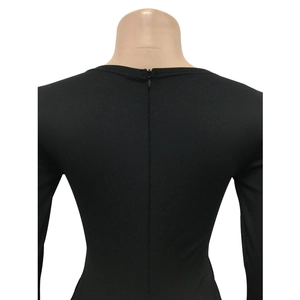 Close-up of the back hidden zipper closure on the black long sleeve jumpsuit garment