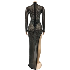 Detail of sheer black mesh dress with silver rhinestones and back zipper closure