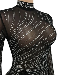 Detailed view of black mesh top featuring silver rhinestones in a wavy pattern