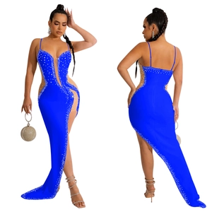Detail of royal blue rhinestone evening gown with high slit and sheer mesh panels