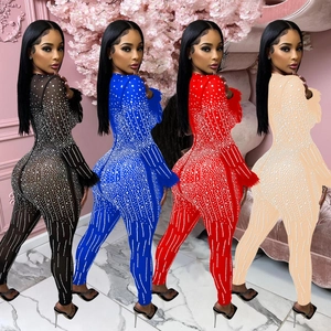 Detail view of sparkly mesh jumpsuits featuring rhinestones and feather trim in four colors