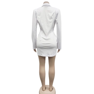 Rear view detail of a slim fit white blazer dress with tailored back waist stitching