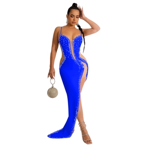 Detail of royal blue v-neck evening gown with rhinestones and mesh cut-outs