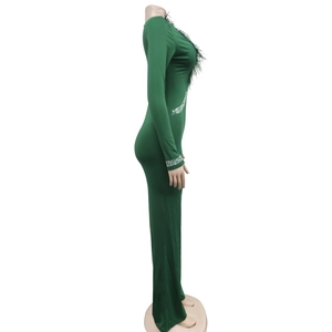 Detail of dark green jumpsuit with feather trim neckline and sparkling silver rhinestones