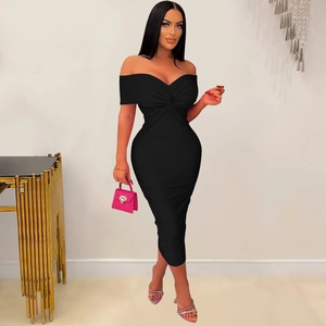 Detail of elegant black off-shoulder dress featuring twisted pleated bust and slim fit design