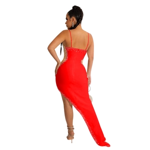 Detail of red rhinestone evening gown showing side mesh panels and shimmering silver crystals