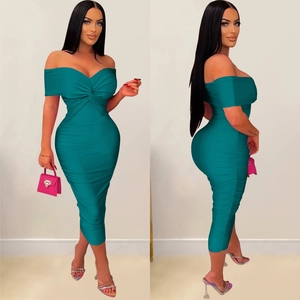Detail view of the ruched texture and slim fit design on this teal midi dress