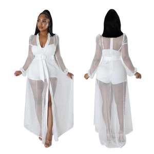Detail of white mesh see-through cover-up with waist belt and long sleeves for women