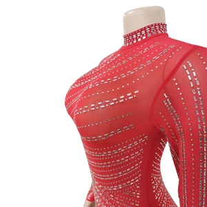 Detailed close-up of the red mesh bodysuit featuring sparkling silver rhinestones and high neck