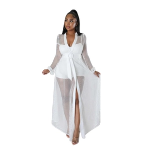 Detail view of white mesh bodysuit with elegant long sleeve cardigan and round buckle belt
