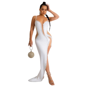 White slim evening gown with rhinestones, deep V-neck, mesh cutouts, and high side slit
