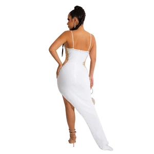 Detail of white sequin dress featuring low back design and sheer mesh panel with pearls