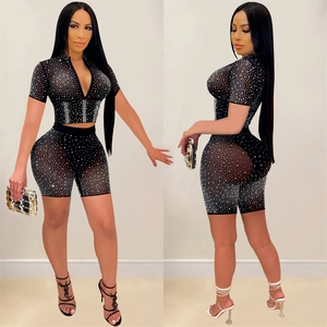 Women's black mesh two-piece set featuring short sleeve crop top and high waist biker shorts