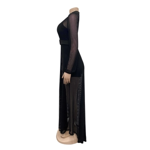 Detail of elegant black mesh long sleeve bodysuit with sheer layers and belted waistline