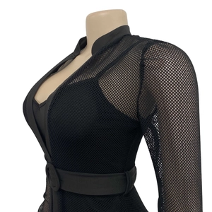 Detail of sheer black mesh bodysuit featuring a stand collar and belted waist detail