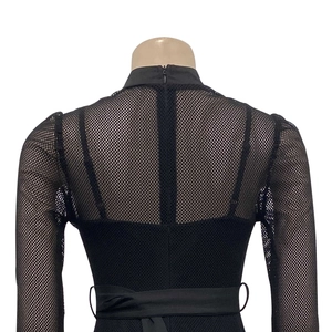 Detail of elegant black mesh long sleeve bodysuit with back zipper and stand-up collar