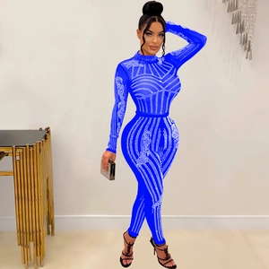 Detail view of royal blue jumpsuit with glittering rhinestones in geometric patterns