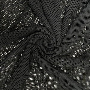 Close-up of black hexagonal honeycomb mesh fabric with lightweight texture