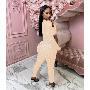 Detailed view of nude mesh jumpsuit with sparkling rhinestones and long sleeves for women