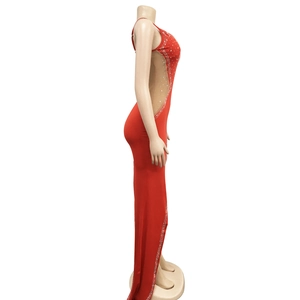 Detail of red sleeveless evening gown featuring silver rhinestones and mesh side panels