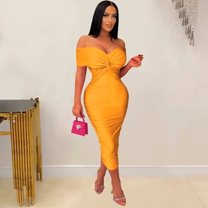 Detail of orange off-shoulder bodycon dress with elegant twisted pleated neckline design