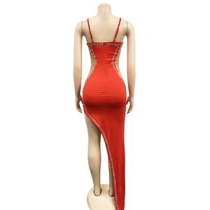 Detail of red backless rhinestone dress featuring crisscross straps and slim fit tailoring