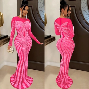 Detail of fuchsia evening dress featuring rhinestone butterfly patterns and fish tail hem