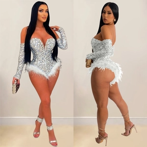 Detailed views of silver sequin romper with white feather trim and matching gloves