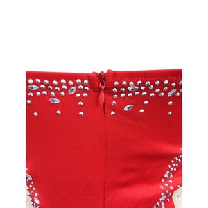 Close-up of red V-neck dress back with rhinestones and matching invisible zipper