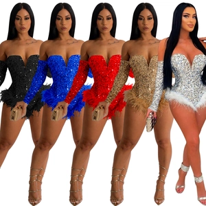 Detail view showing five colors of sequin strapless rompers with feather trim details