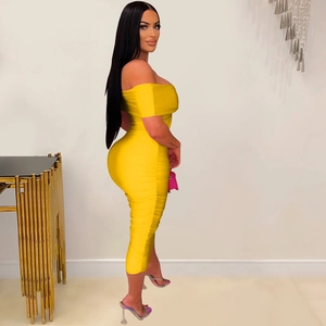 Detail view of yellow off-shoulder midi dress with elegant ruching and slim fit design