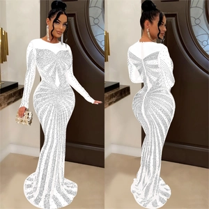 Close-up detail of white mesh maxi dress with silver rhinestones and mermaid tail design