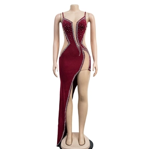 Detailed view of the burgundy evening dress featuring mesh cutouts and rhinestones