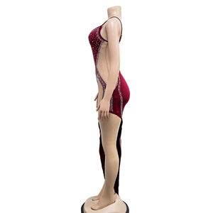 Detailed view of dark red dress with sheer mesh side panel and sparkling rhinestones