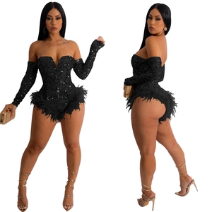 Detail of black sequined bodysuit featuring deep V-neckline and feathered hemline trim