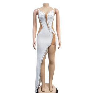 Detail of white V-neck dress with silver rhinestones and sheer mesh patchwork inserts