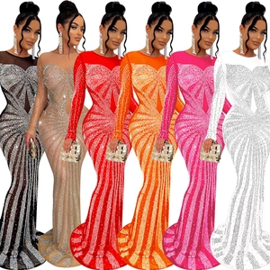 Detail of sheer mesh maxi dress showing various colors with sparkling rhinestone patterns