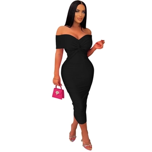 Detail of black strapless tube dress featuring front twist knot and ruched pleated design