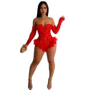 Close-up of bright red sequined bodysuit with feathered hem and matching long sleeves
