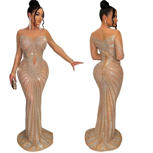 Detailed view of silver rhinestones and mesh texture on luxury evening fishtail gown