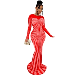 Detail of red mesh evening dress with heart-shaped silver rhinestone patterns