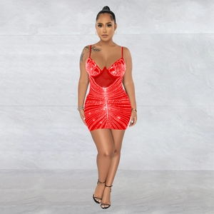 Close-up of red bodycon dress featuring rhinestone embellishments and mesh detailing