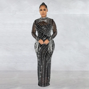 Elegant black mesh dress with rhinestones, long sleeves and fringes for evening gala