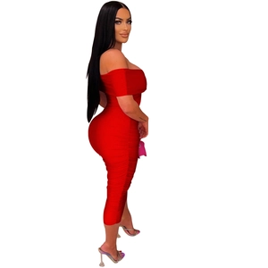 Detail view of red off-shoulder slim dress with pleated side seams and ruched texture