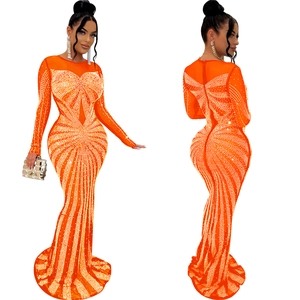 Detailed front and back view of vibrant orange evening gown with rhinestones and mesh