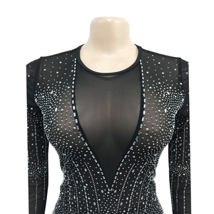 Detail of black mesh jumpsuit with V-neck sheer insert and silver sparkling rhinestones