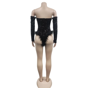 Rear view of black sequin bodysuit featuring feather trim and matching sleeves